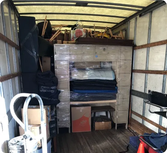movers carrying TV